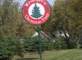Welcome sign near entrance to farm.